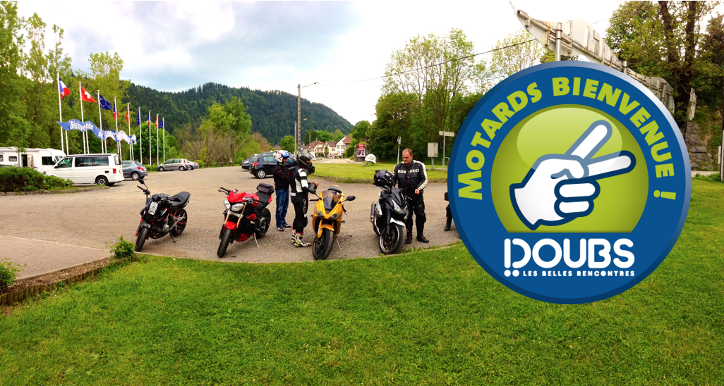 a group of people that are standing in the grass